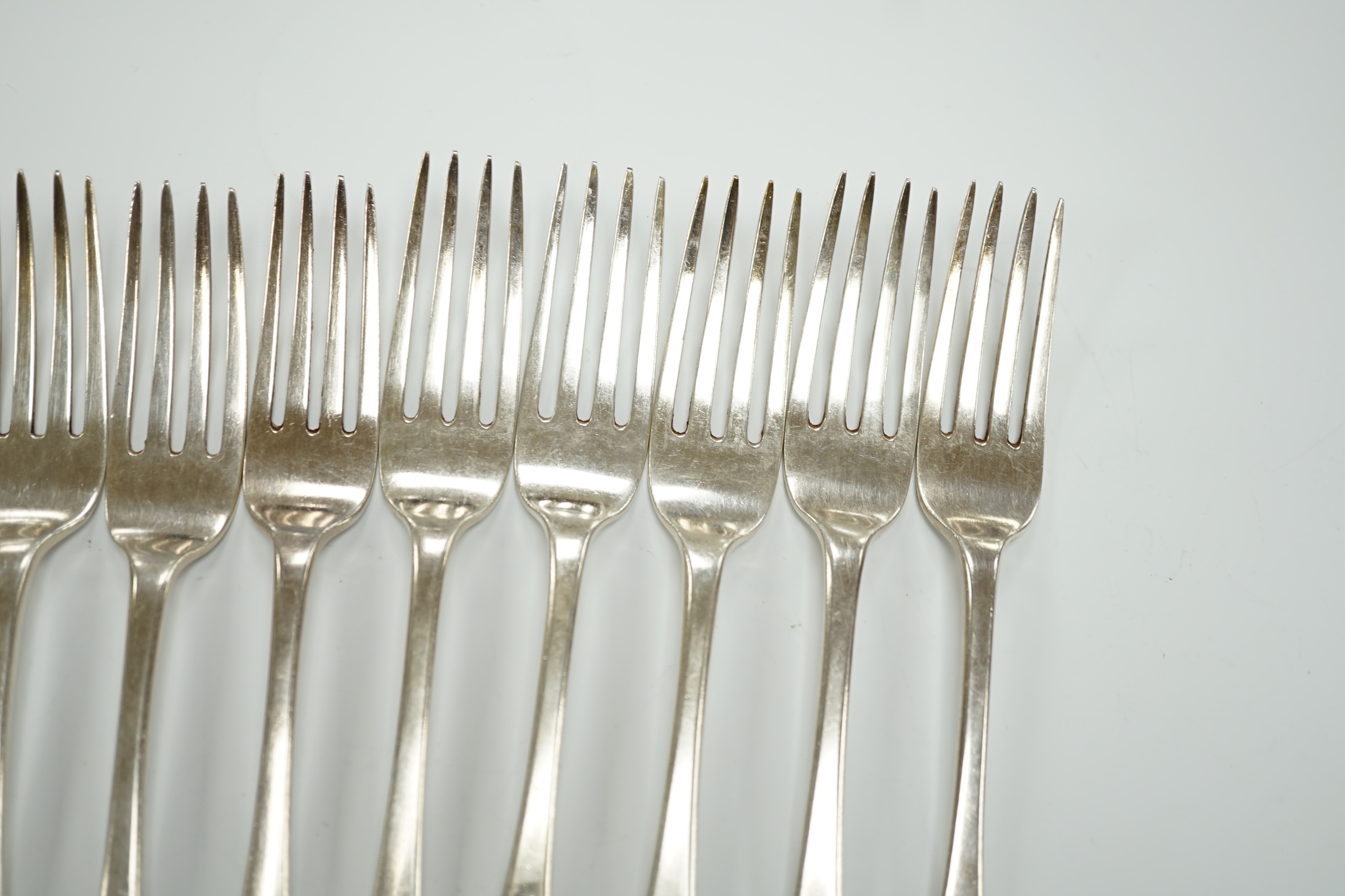 A set of six George IV silver table forks, London, 1824 and a later similar Victorian set, London, 1837, 25.8oz.